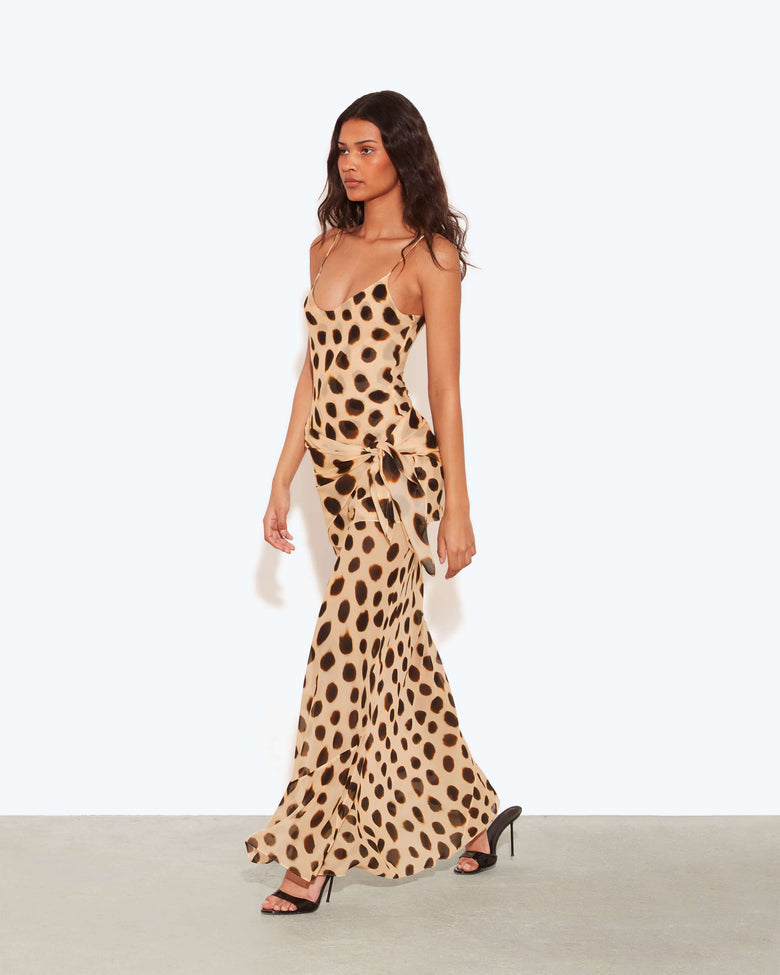 Spot Tie-Waist Slip Maxi Dress. Chic sarong-style hip tie, and a bold oversized animal print—perfect for island nights and glamorous sunset dinners.
